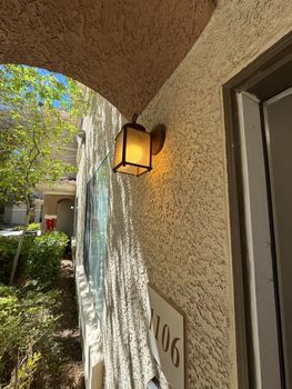 PATIO LIGHT OUT → BULB REPLACED